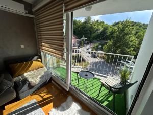 a balcony with a view of a street at CENTRAL POINT APARTMENT - City centar Zenica- in Zenica