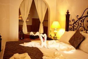 Postel nebo postele na pokoji v ubytování Hotel Quinta Mision
