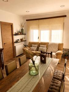 a living room with a table and a couch at La Cantera in Corbera