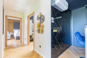 a room with musical instruments on the wall at Elite House Gold Apartment in Leányfalu +26 photos