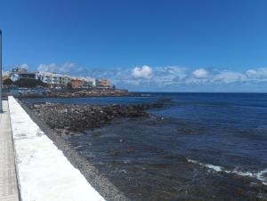 a view of the ocean from a pier at Alojamiento Gofioplaya in Arinaga
