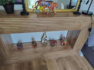 a group of toy figurines sitting on top of a shelf at Maison chic & chill in Saint-Brieuc +34 photos