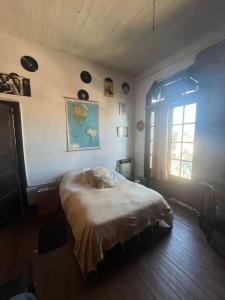 a bedroom with a bed in a room with a window at Republica Hostel in San Pedro +35 photos
