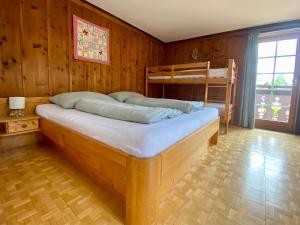 a bedroom with two bunk beds in a room at Villa Zeppelin - App Smaragd in Bramberg am Wildkogel +14 photos