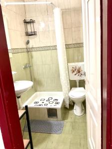 a small bathroom with a toilet and a sink at Apartmani Ilić in Herceg-Novi +66 photos