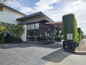 a building with a sign in front of it at The RiverKwai Bridge Resort 2 in Ban Chuk Kum