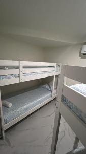 a room with two bunk beds in a room at SIMPL hostel Oquendo in Madrid +21 photos