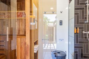 a glass door in a kitchen with a table at Elite House Platina Apartment in Leányfalu +32 photos