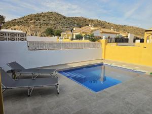 a swimming pool on the roof of a house at Bluemoon in Mazarrón +12 photos