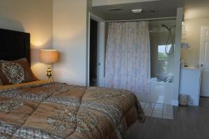 a bedroom with a large bed and a window at River Place Condos #410 3BD in Pigeon Forge