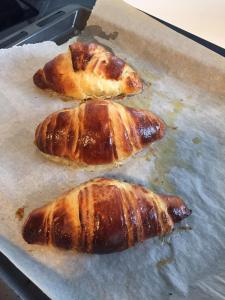 three food items sitting on top of a baking sheet at Brøndums B & B in Hjørring +16 photos