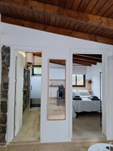 a room with a view of a bedroom and a bed at La Campestre in La Guancha