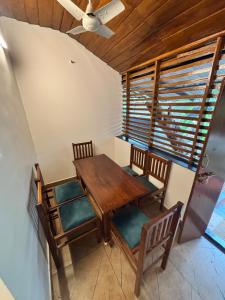 an overhead view of a dining room table and chairs at Chettiparambil Heritage in Cochin