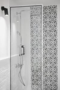 a bathroom with a shower with a glass door at Aurelia Boutique - Suites in Rhodes Town +34 photos