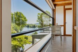a balcony with a view of the water at Villa Osmani in Shkodër