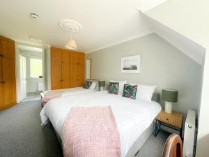 a bedroom with two beds and a window at Ivy Guesthouse in Kilkenny