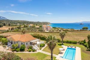 an aerial view of a house with a swimming pool at Villa Polymnia in Kaligata