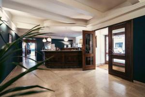 a large room with a kitchen and a lobby at Hotel Italia in Turin