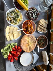 a table filled with different types of food on it at Guest House koshki in Iprari