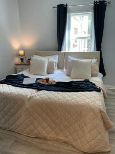 a large bed with a tray on top of it at Chamberlain House in Derry Londonderry