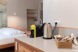 a coffee maker on a counter in a room with a bed at La Casa di Nadì in Matera