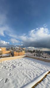 a view from the roof of a building with snow at ZÜMRÜT KONAĞı in Mardin