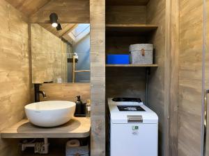 a small bathroom with a sink and a stove at Chalet Baita Aria - AffittiPontediLegno in Ponte di Legno