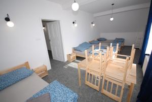 a room with a table and chairs and a dining room at Noclegi Dywity Barczewskiego 27 in Dywity