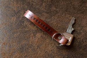 a brown key chain sitting on top of a table at APPENNINS Annecy Rent Lodge in Annecy +4 photos