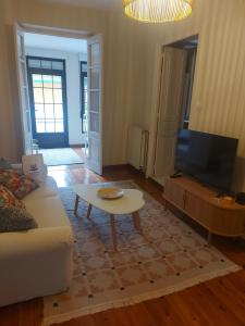 a living room with a couch and a coffee table at El Café I in Nava