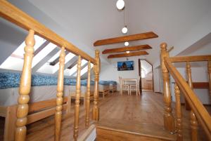 a bedroom with a bed and a dining table at Noclegi Dywity Barczewskiego 27 in Dywity