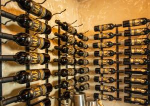 a bunch of wine bottles hanging on a wall at Casa Condado Hotel & Residences in San Juan