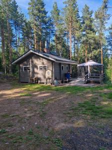 a cabin in the middle of a forest at Metsämökki in Lohja
