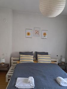 a bedroom with a bed with two towels on it at TILIA Apartmet in Struga