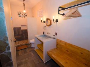 a bathroom with a sink and a toilet at Cabañas Chechén Chaká in Leona Vicario +44 photos
