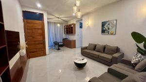 a living room with a couch and a table at The Yoyo's Stay in Arusha