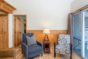 a living room with a chair and a lamp at Krystal Villa #5 in Ketchum