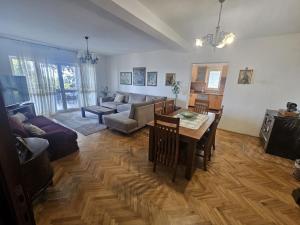 a living room with a table and a couch at Vesna Apartments in Ulcinj