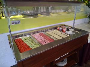 a refrigerator filled with different types of food at Hotel Mosel Star in Bernkastel-Kues +10 photos