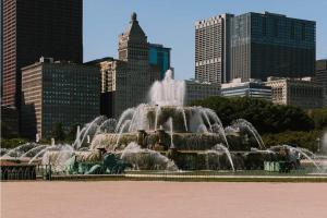 a fountain in the middle of a city with buildings at Kasa Lake Shore Chicago in Chicago