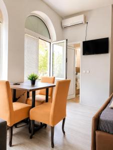 a dining room with a table and chairs at Villa Jovan Gevgelija in Gevgelija
