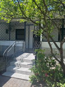 a staircase leading to a building with a gate at Robinson Hotel in Zatoka +12 photos