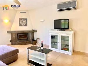 a living room with a flat screen tv on a wall at Villa Marina - Inalko in Alcossebre