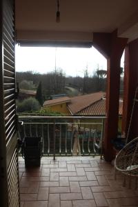an open balcony with a view of a building at Appartamento in Villa Nadin in Monte Compatri