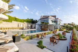 an image of a house with a swimming pool at Cesme Sarezya Luxury Boutique Hotel in Çeşme