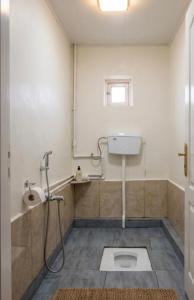 a bathroom with a toilet and a sink at Ecomama in Xınalıq Khinalig guest house in Xınalıq +36 photos