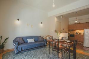 a living room with a couch and a table at The Beach House in Karistos +32 photos