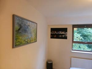 two paintings on the wall of a room at Sequoia Tree in Belfast