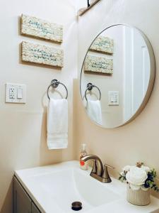 a bathroom with a sink and a mirror at Quiet retreat near Coconut Grove free parking in Miami +42 photos