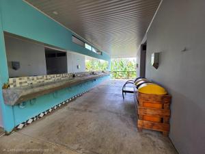 a long line of sinks in a room at Senda Adults Only Hostel in Manuel Antonio